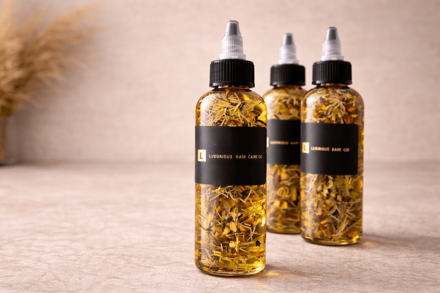 Luxurious Hair Care Co. herbal hair oil bottles, handcrafted for stronger, healthier hair