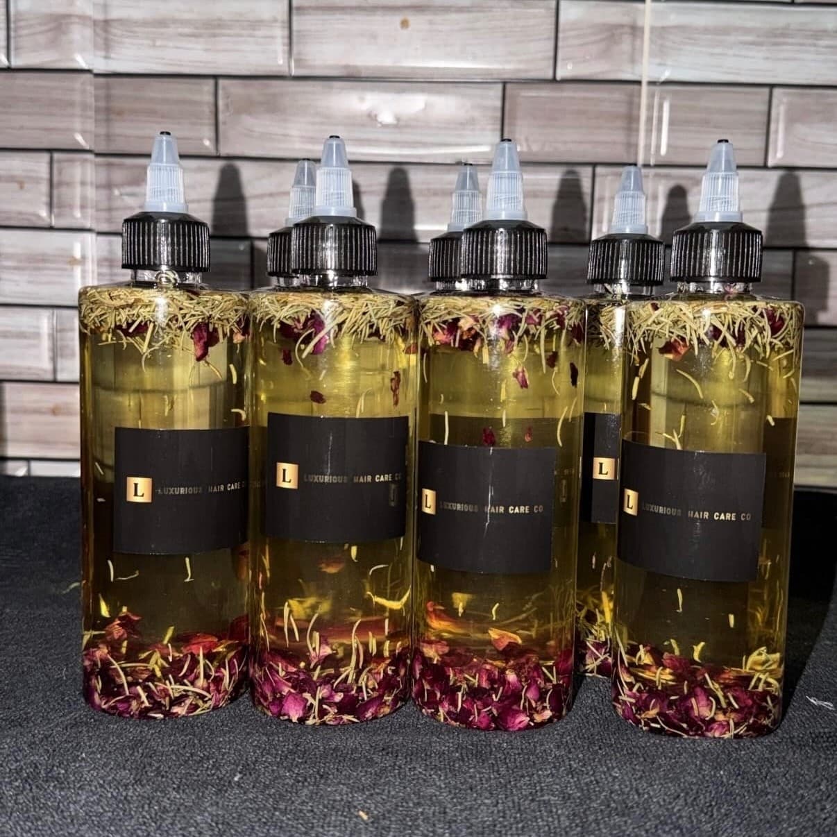 Luxurious Hair Care Co. Extreme Hair Growth Oil bottles with herbal botanicals