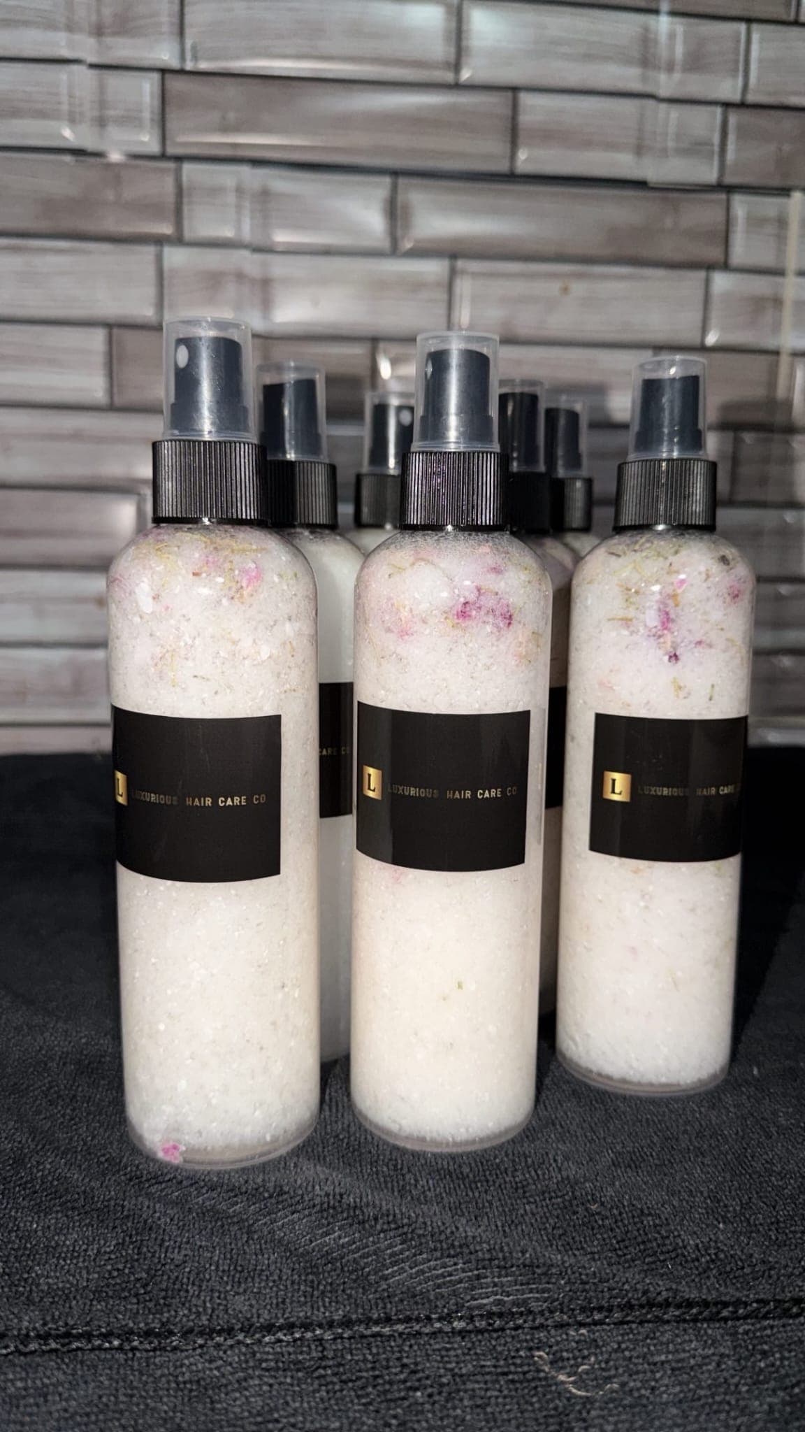 Luxurious Hair Care Co. Biotin Infused Leave-In Conditioner & Heat Protectant spray bottles
